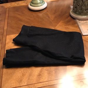 Inc leggings with black metallic color.